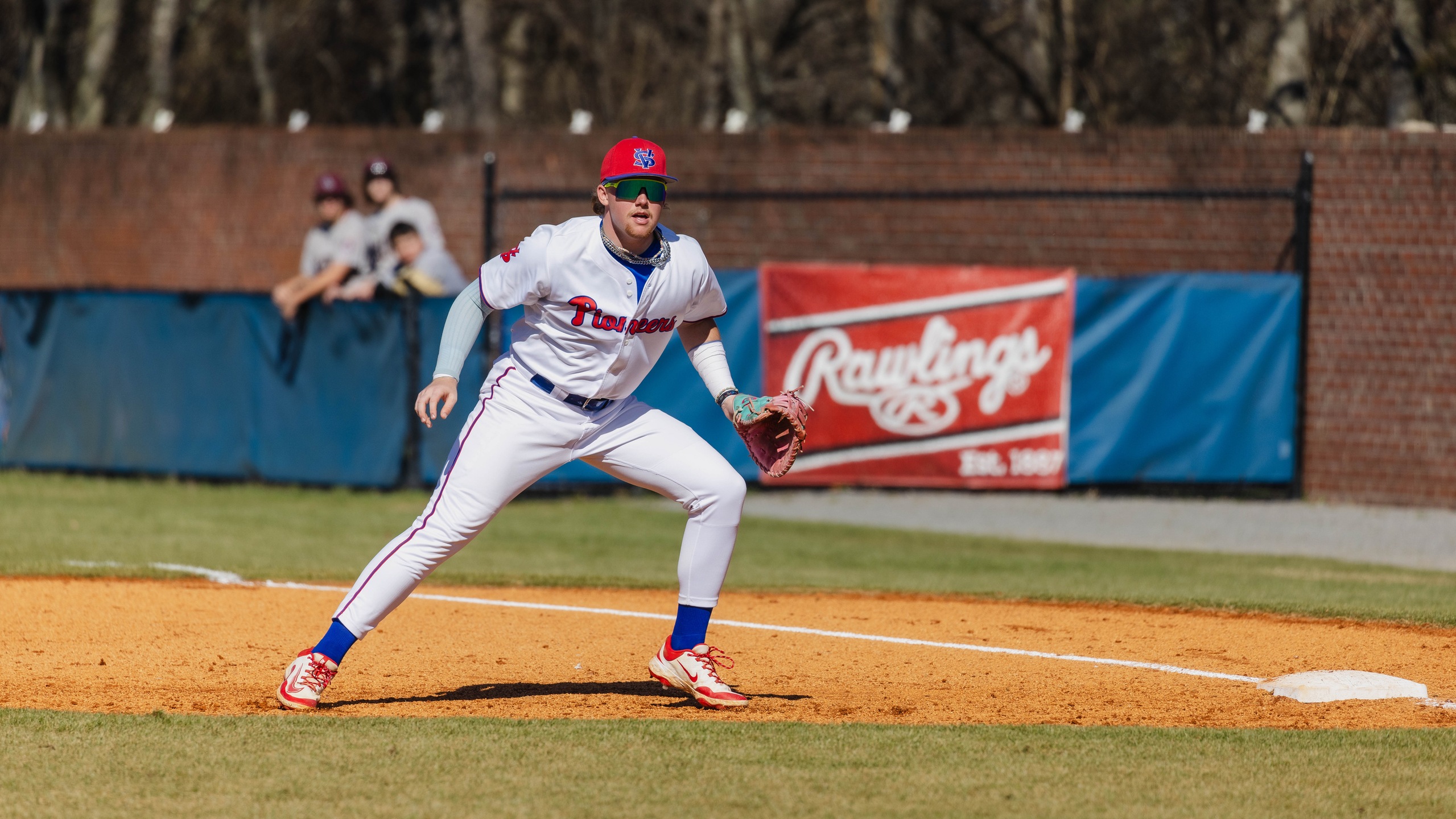 Easton Denning at first base, fielding a ground ball.